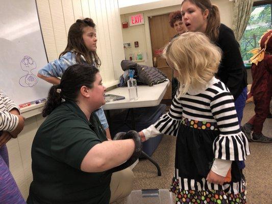 Touching an Eastern rat snake at the Park's Dia de los Muertos family event