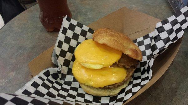 Big Breakfast sandwich ($7.99 + tax). Croissant sandwich with two eggs and two sausage patties.