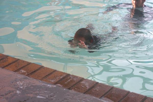 Swimming toward wall during final swim test.