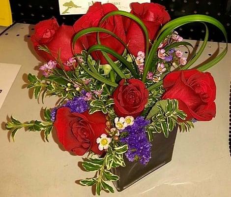 Not my idea of a deluxe version of Teleflora's Sweet Thoughts Bouquet with Red Roses, TEV13-7B.