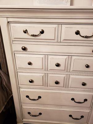 Chest of drawers finished white with a gray glaze