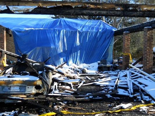 Fire-damaged car port in Wilmington, NC.