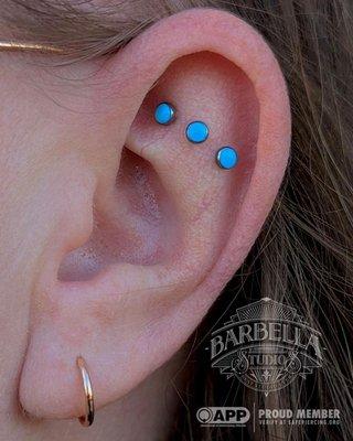 Healed triple flat with Turquoise cabs from NeoMetal, pierced and photographed by Stephen!