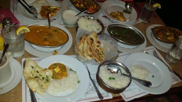 Raita, garlic naan, rice, matar paneer, vegetable korma.