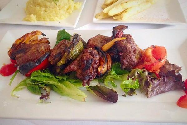 Lamb Kebobs: cooked on rotisserie, fresh herbs + tomatoes + peppers + onions