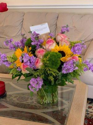 What was delivered. Nothing like the website photo.  Missing many flowers. A bait and switch.