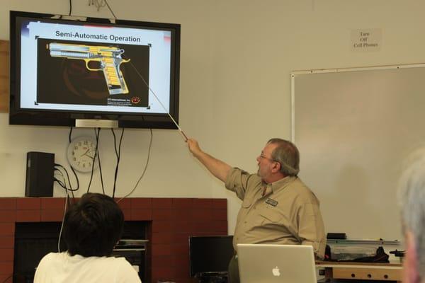 Frank, teaching the operation of a Semi-Auto Pistol.