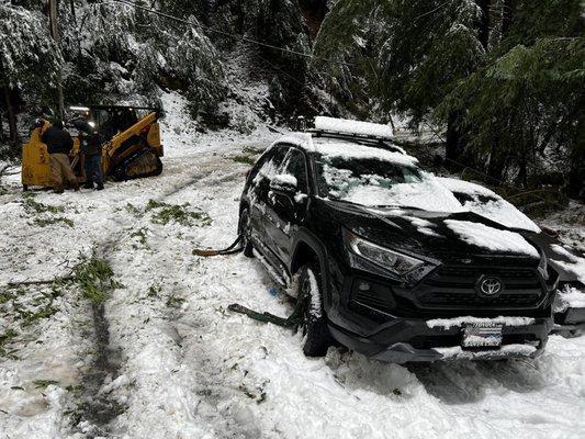 Preparing to pull car off other vehicle