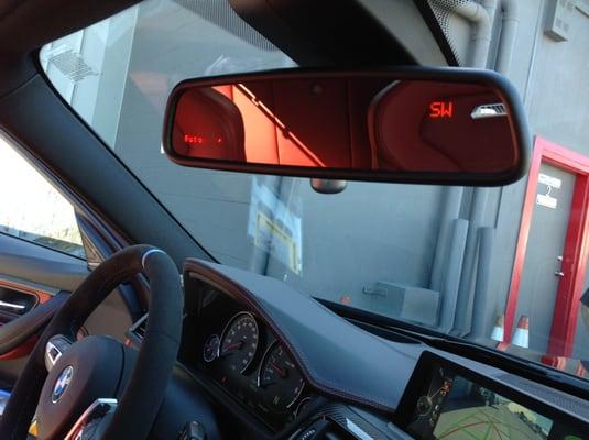 Escort Radar/Laser system display installed in a 2016 BMW M3 rear view mirror