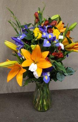 spring flowers with iris, roses, and lilies