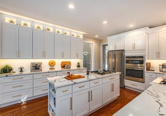 Kitchen remodeling project in Falls Church, VA with white kitchen countertop & wooden flooring