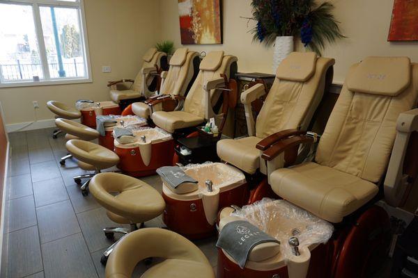 Pedicure chairs with massage rollers and sanitary disposable liners