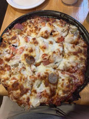 German pizza ( sauerkraut, pickles, bratwurst, cheese)