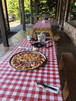 Outside eating, pizza! Yum!