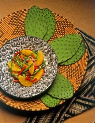 Tender Nopal cactus pad salad served with roasted red bell peppers and sweet juicy citrus segments.