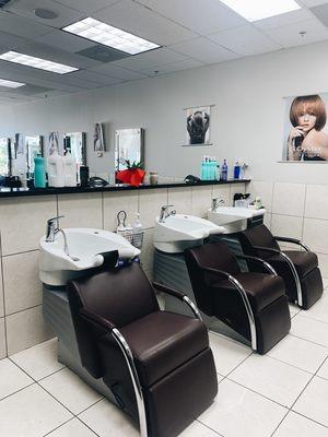 Shampoo bowls in the back of the salon