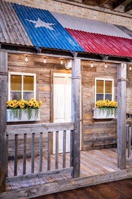 Our rustic cabin porch is a great space for portraits and telling the world how much you love Texas!