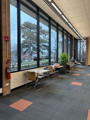 tables with outlets next to the windows