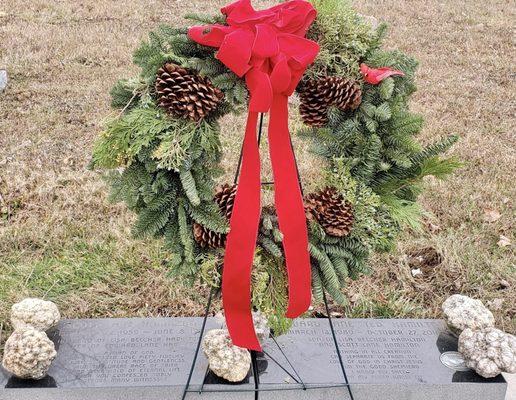 Flowers and Interiors created this wreath for my husband's and son's graves.