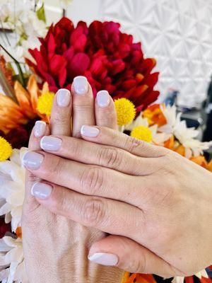 Elegant French tips on gel builder done by Angie