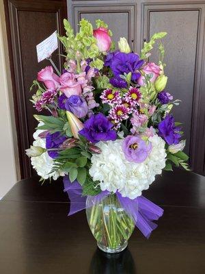 Stunning arrangement with beautiful flowers and color!