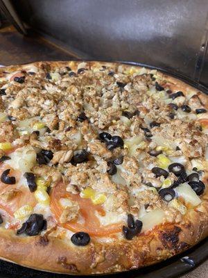 The pizza pictured above is chicken, tomato, olive, corn & pineapple! Delicious!