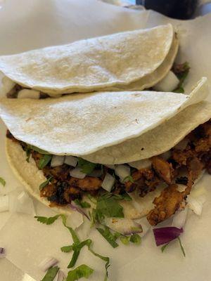 Al pastor and Barbacoa tacos. Great portions.