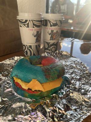 Rainbow bagel with sausage egg and cheese