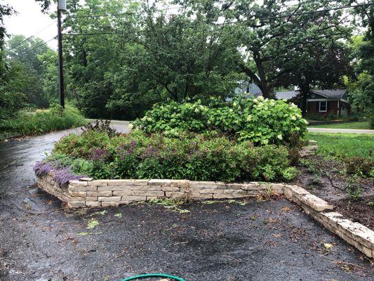 In addition to the plantings they did an amazing two-tier stone retaining wall.