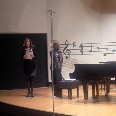 Nancy Laturno Bojanic(left) and Ann-Marie McDermott address the audience before the performers take their places at the Mainly Mozart fest.