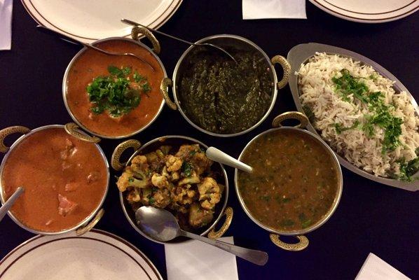 (Left to right) Butter Chicken, Chicken Tikki Masala, Aloo Gobi, Palak Paneer, Daal Makhni, Basmati Rice