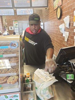 Subway worker not wearing a mask during a pandemic. Gross.