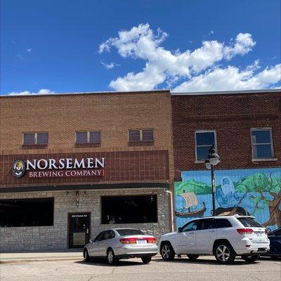 Façade of the Norseman Brewing Company and accompanying wall art