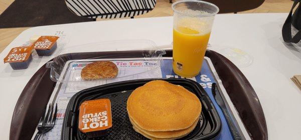 Hotcakes and sausage orange juice.