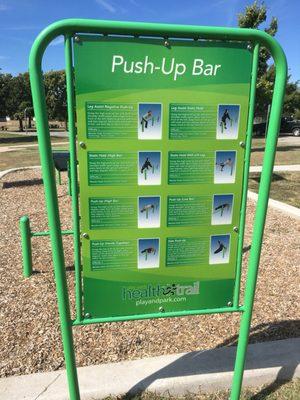 There is a station near the concrete walking trail. It claims you can do three activities there includes pushups.