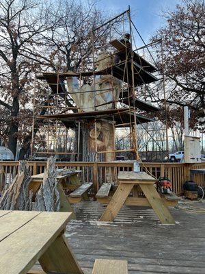 Huge patio during the warmer days! This awesome wood carving in the making!