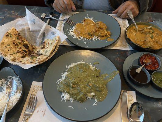 The green one is Chicken Palak. IOrange one is Chicken Madras, a curry dish, and is kind of spicy. The naan garlic bread is fabulous!