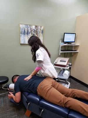 Intern Kaede at work. Notice the machine in the back - shock waves that break up scar tissue in my wrists. Excellent equipment here.