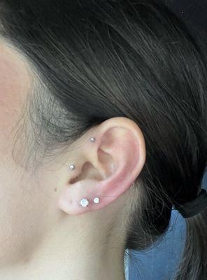 Tragus, forward helix, 2nd and 3rd lobes done by Monica