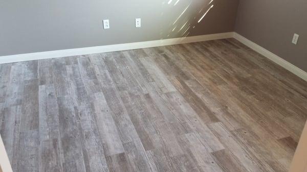 Porcelain tile made to look like a wood floor. small 16 inch grout joints add to the authentic wood look.