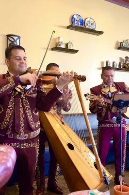 Mariachi Trío Generación de Sacramento playing at restaurant for 60th birthday celebration