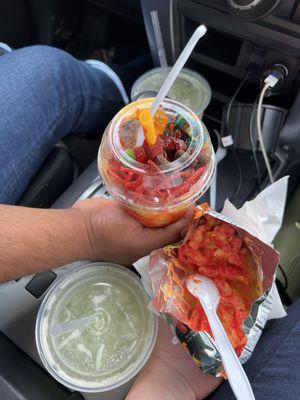 Deli Mango, Agua de pepino con limón & hot Cheetos with cheese.