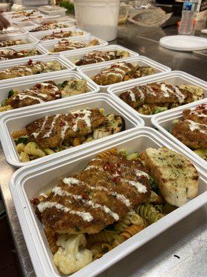 Chicken Milanese topped with boursin crème sauce served over pasta primavera.