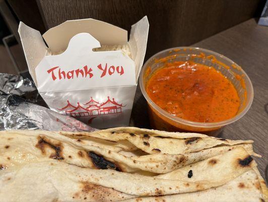 Butter chicken, rice, and Naan Bread