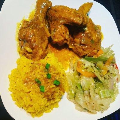 Curry chicken, yellow rice, Caribbean Jamaican style cabbage