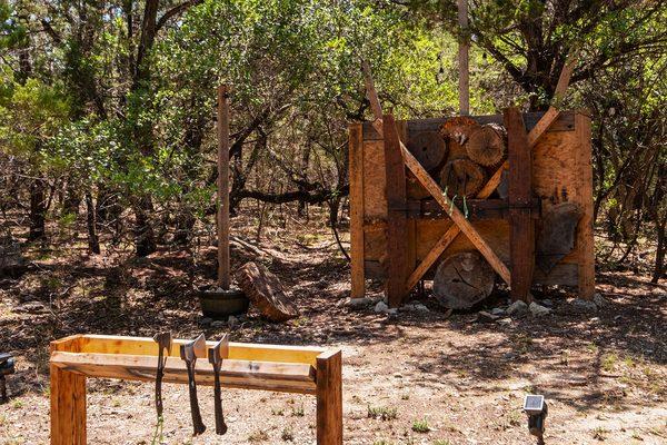 Axe throwing wall and lit for the night hand throwing!