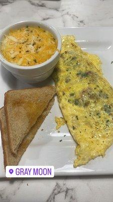 Garden Omelette, Grits, and Toast. Food was amazing. Service was good! People were very friendly. Will definitely be back!