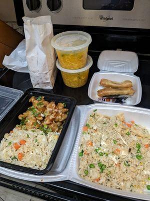 Fried rice, sesame chicken, egg drop soup, and crispy beef spring rolls