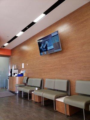 Screen display with patients estimated wait time.