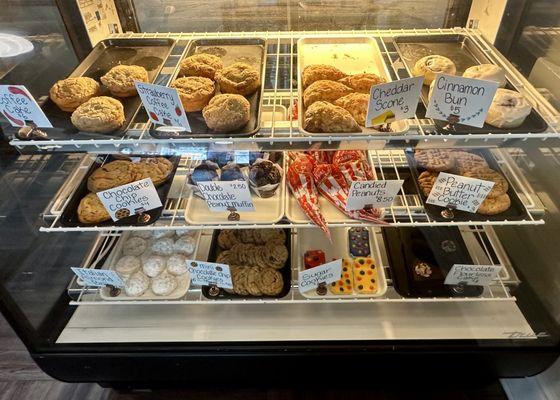 Display case of coffee cakes, scones, buns, cookies, etc.